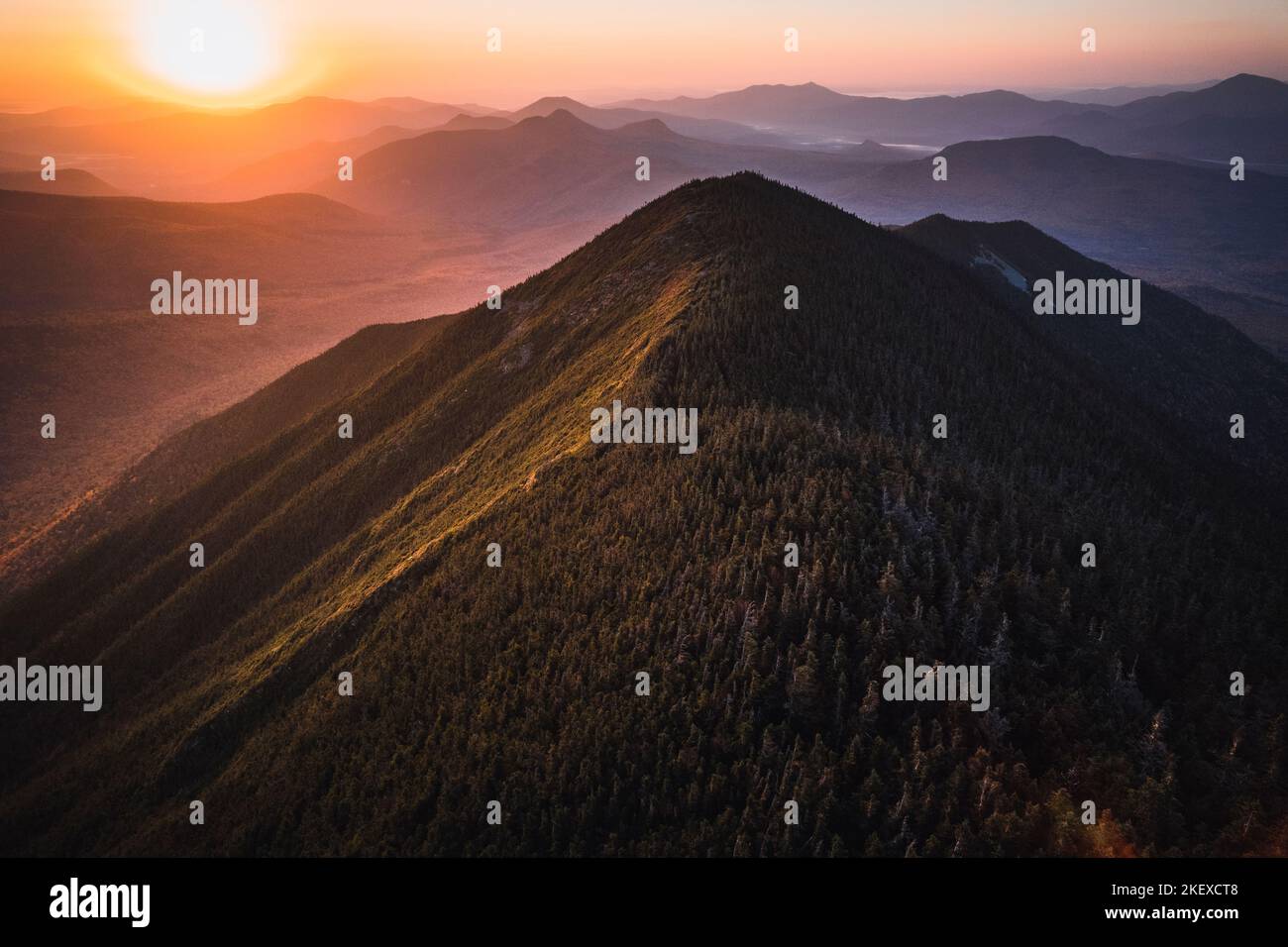Sunrise in vibrant fall colors over Mount Carrigan, New Hampshire Stock Photo