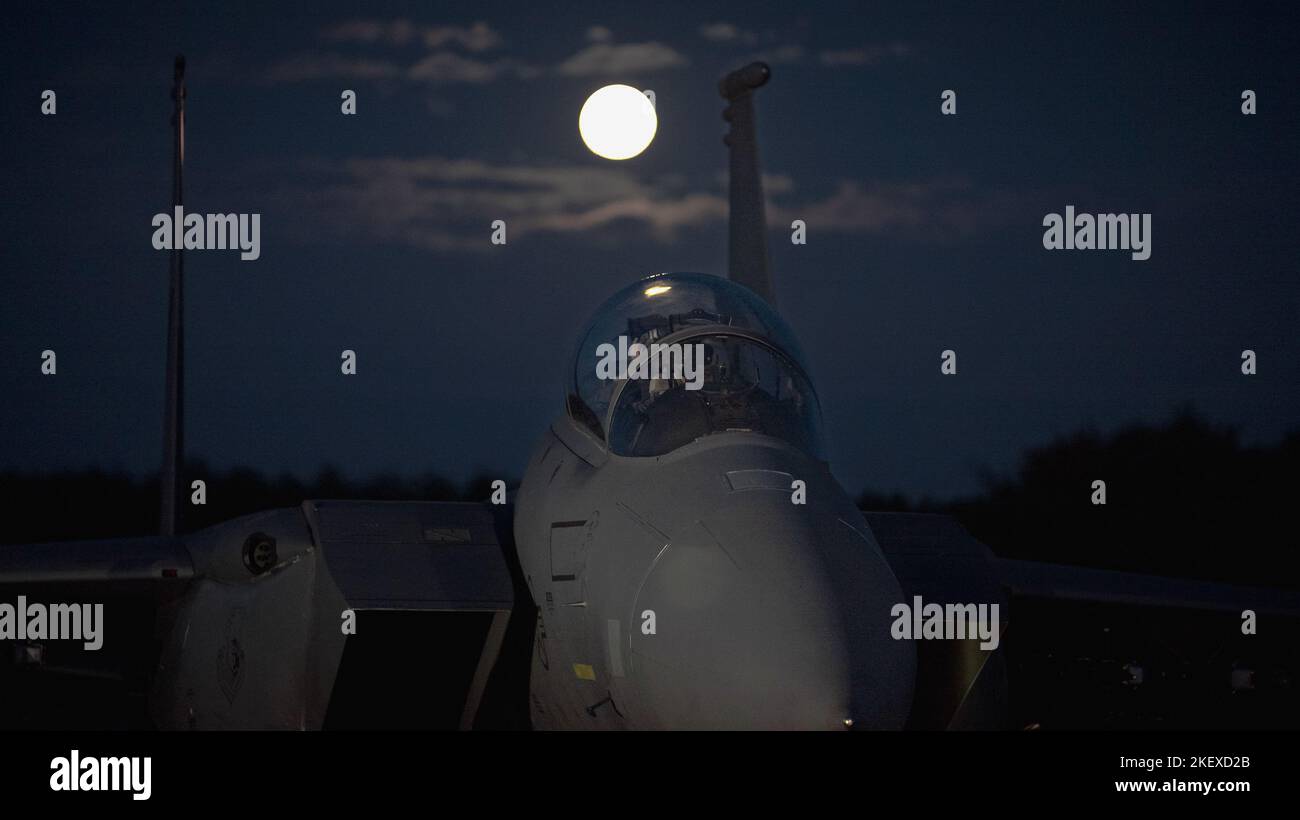 An F-15E Strike Eagle Assigned to the 492nd Fighter Squadron sits on the arming pad prior to takeoff at Royal Air Force Lakenheath, England, Nov. 8, 2022. Night flying is an opportune time for pilots to harness and maintain their readiness should they be called at a moment’s notice. (U.S. Air Force photo by Staff Sgt. Gaspar Cortez) Stock Photo