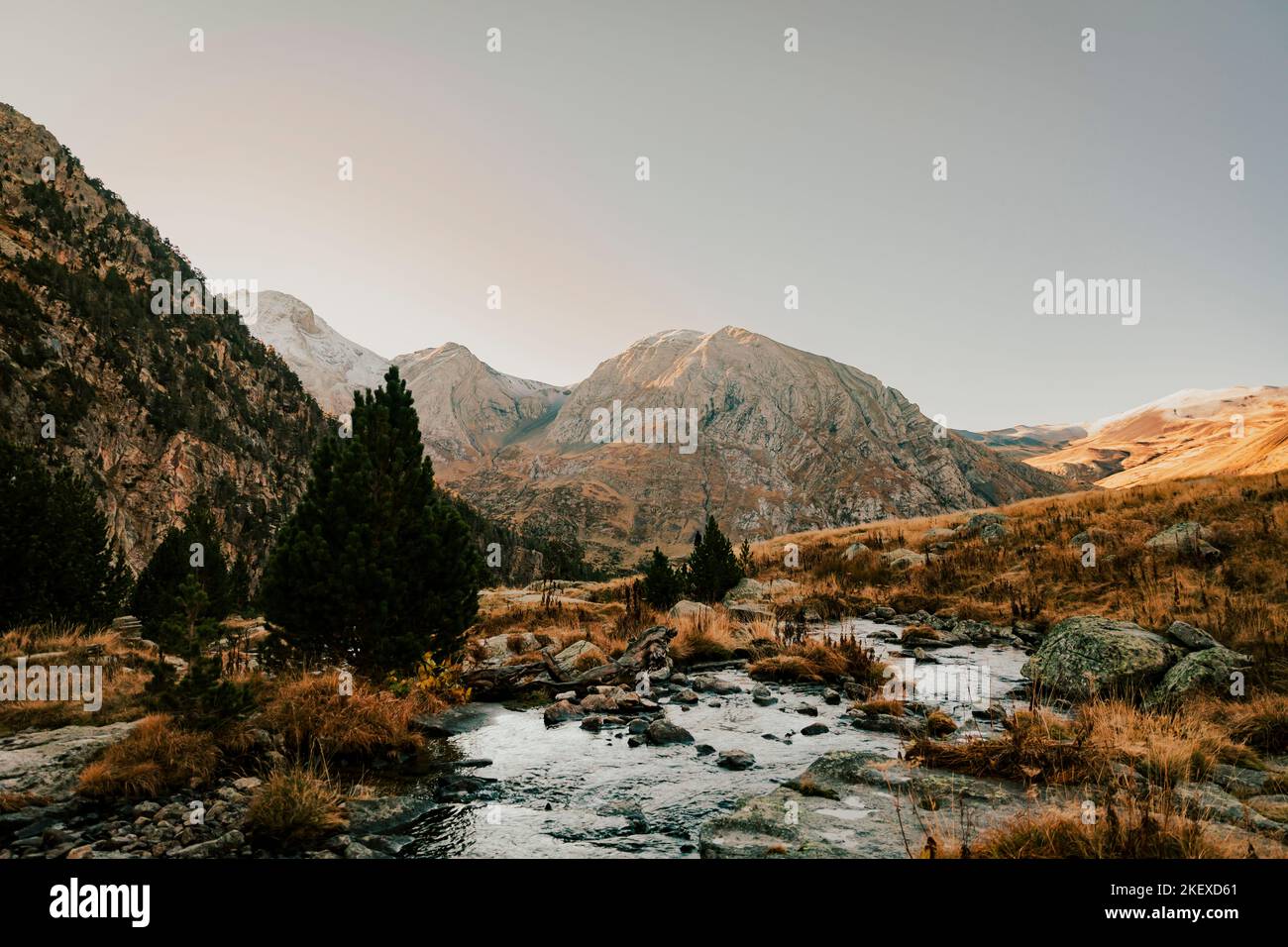 River crossing a valley with a mountain in the background Stock Photo