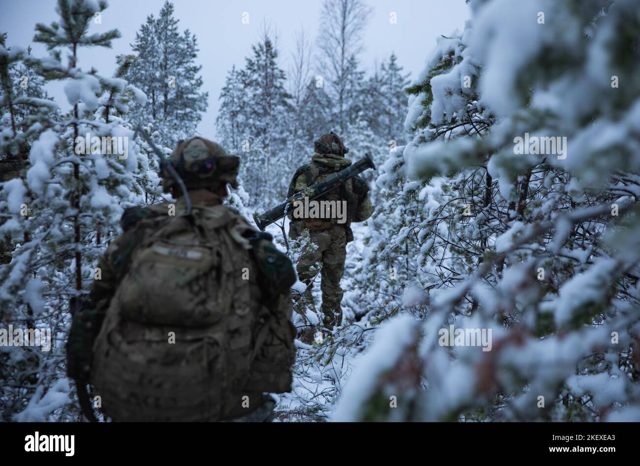 U.S. Soldiers with 6th Squadron, 9th Cavalry Regiment, 3rd Brigade Combat Team, 1st Cavalry Division (3-1 ABCT), operationally assigned to the 1st Infantry Division (1 ID), patrol snow covered woods during Hammer 22, an annual combined forces exercise conducted by and alongside Finland’s Army Headquarters, Armored Brigade, Pori Brigade, Karelia Brigade, Uti Jaeger Regiment and Logistics Department of the Defense Forces, in Niinisalo, Finland, Nov. 9, 2022. The 3-1 ABCT is among other units under the 1 ID proudly working alongside allies and regional security partners to provide combat-credible Stock Photo