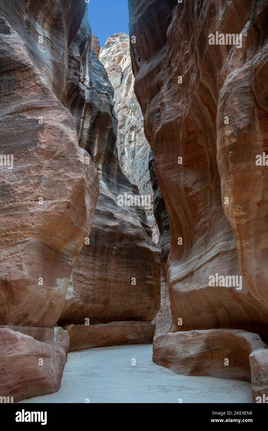 Siq or canyon with carved water channel leading to Treasury Petra Jordan Stock Photo