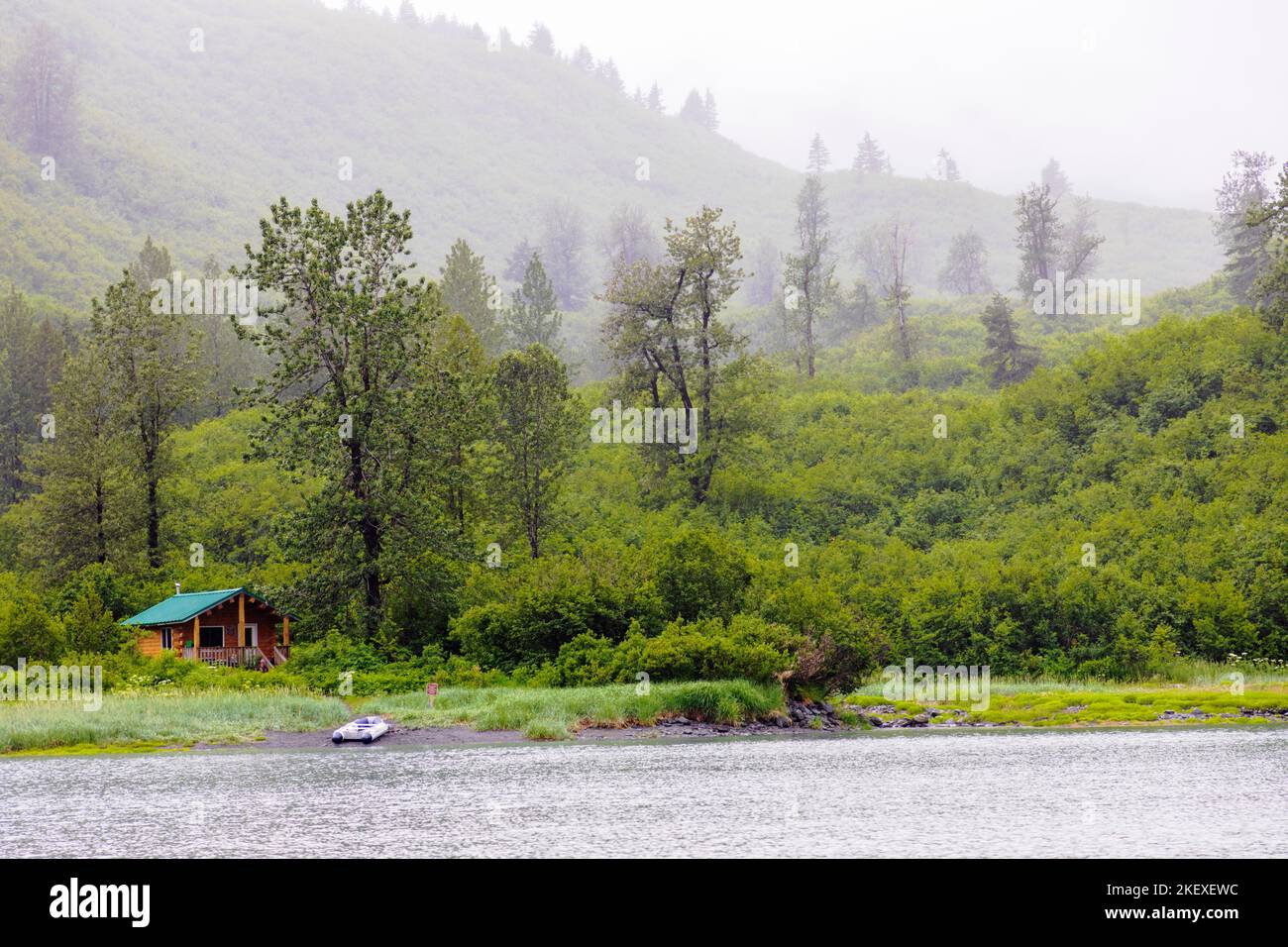 Remote wilderness log cabin; Shoup Bay; Valdez Arm; Prince William Sound; Alaska; USA Stock Photo