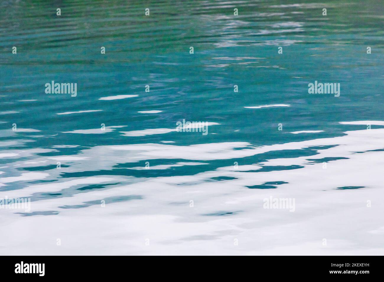 Motorboat creates graphic waves; Valdez Arm; Prince William Sound; Alaska; USA Stock Photo