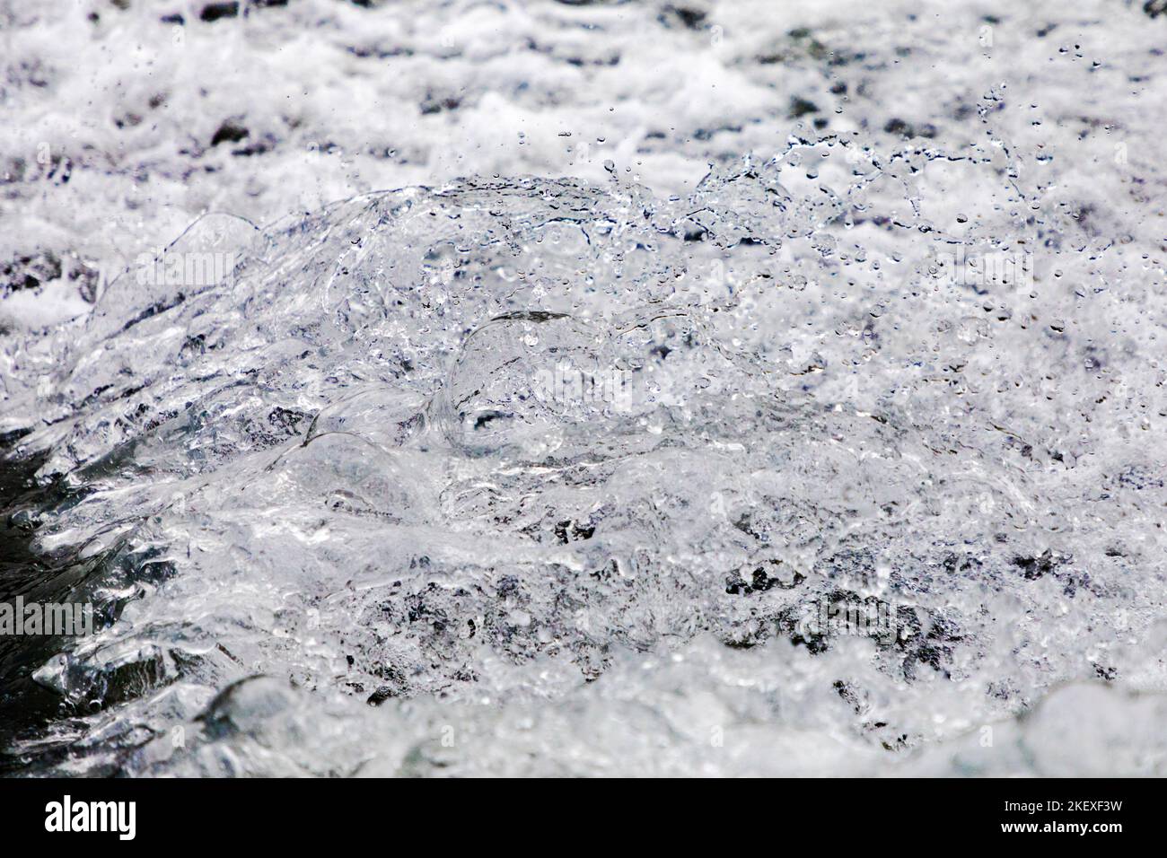 Motorboat creates graphic water droplets; Valdez Arm; Prince William Sound; Alaska; USA Stock Photo