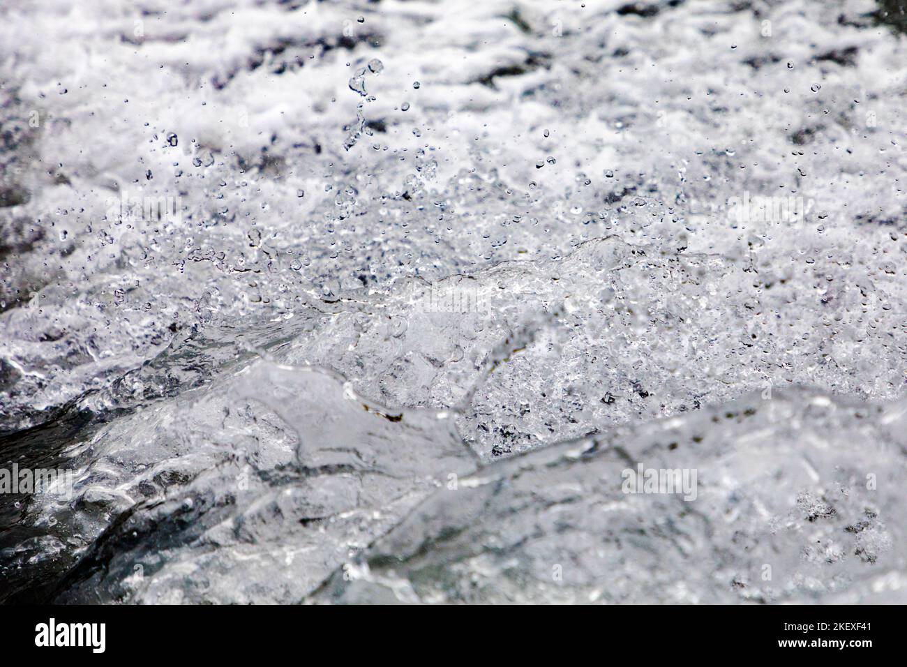 Motorboat creates graphic water droplets; Valdez Arm; Prince William Sound; Alaska; USA Stock Photo
