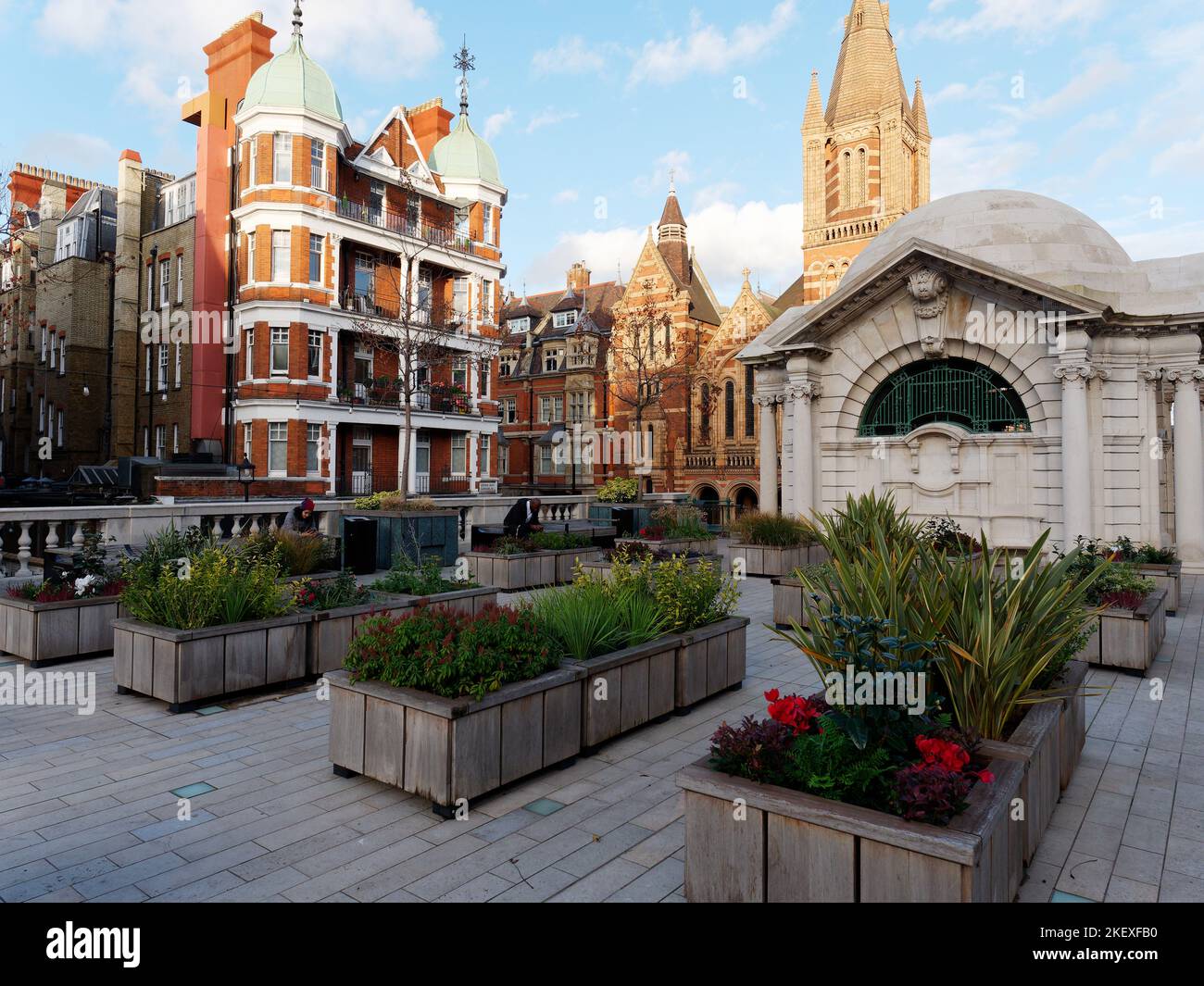 Brown Hart Gardens off Duke Street in Mayfair, London, with the Ukranian Catholic Cathedral behind and elegant apartments left. Stock Photo