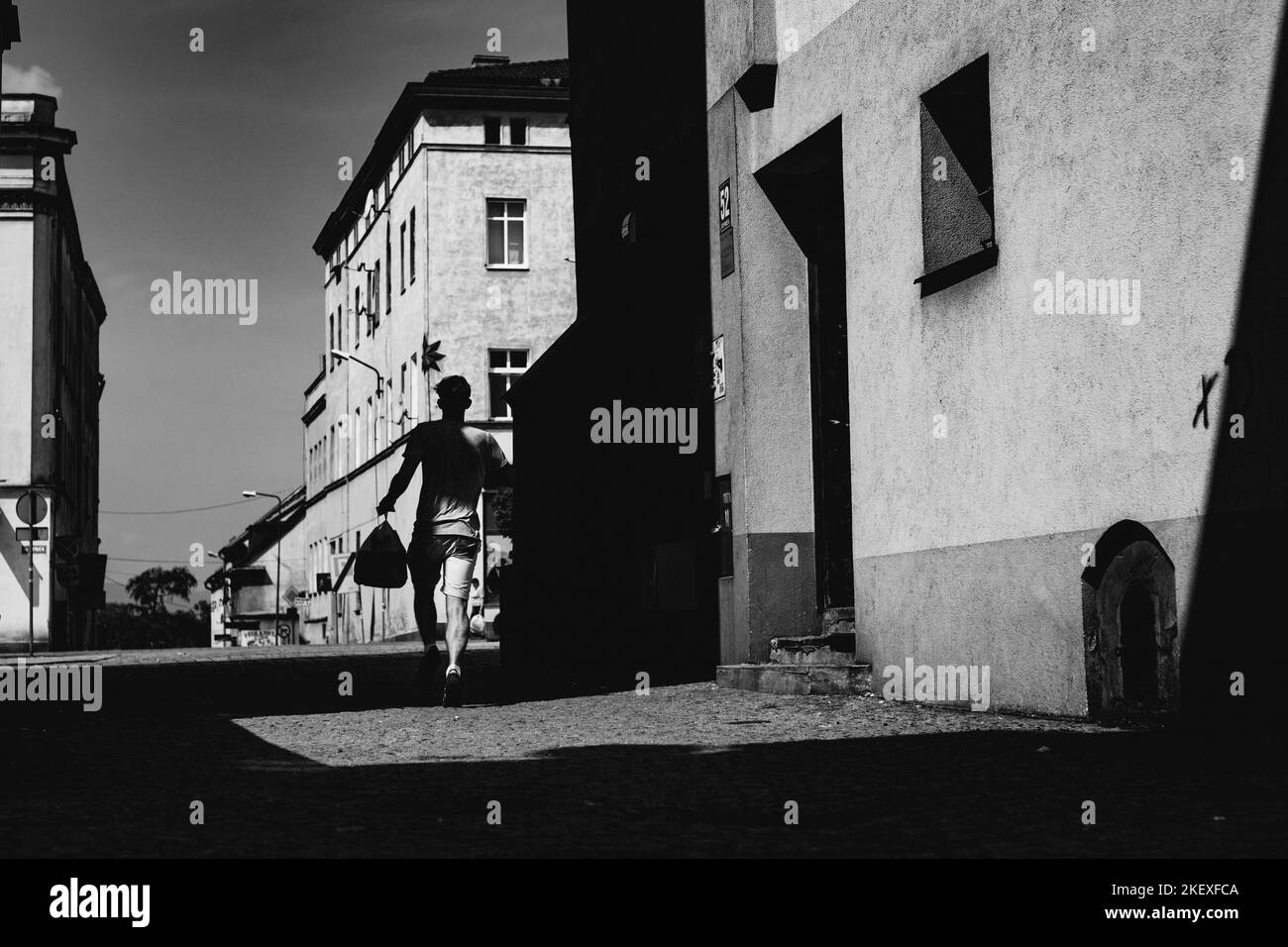 silhouette of the man running up the street Stock Photo Alamy