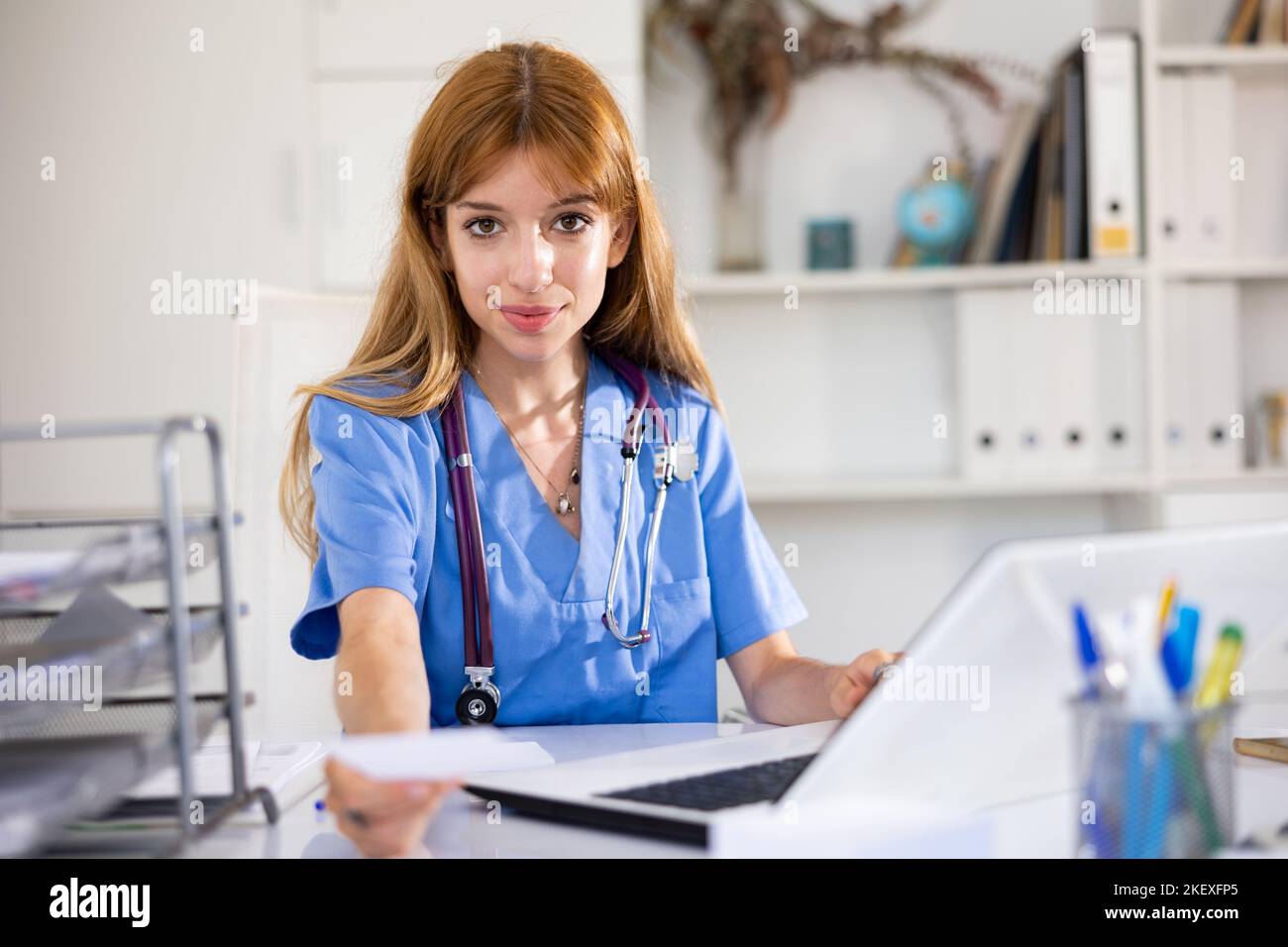 Young smiling physician sitting hi-res stock photography and images - Alamy