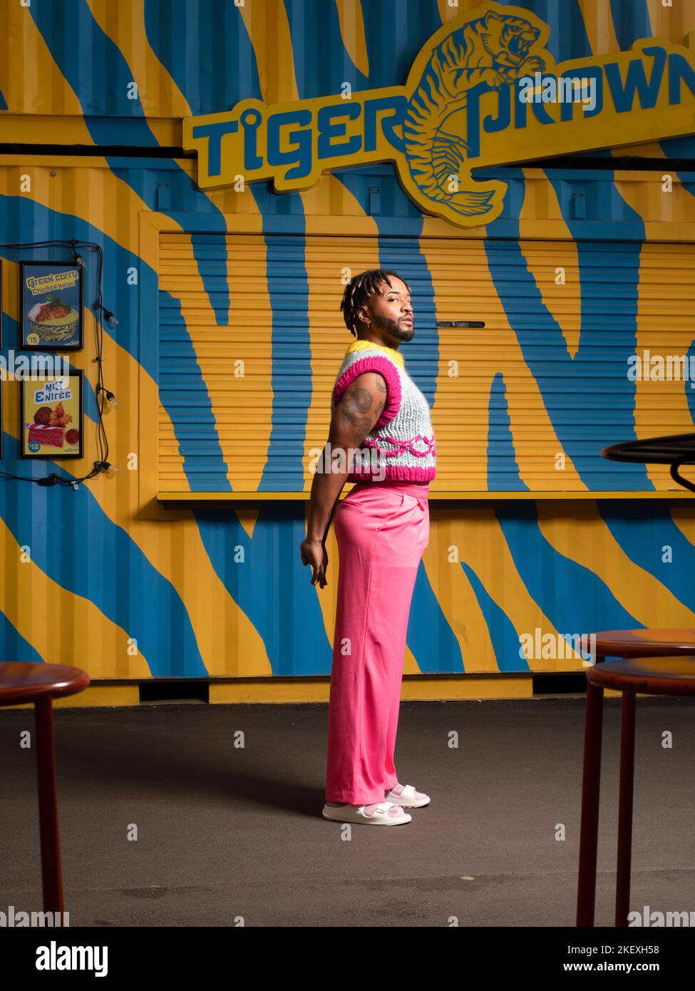 young man in colorful urban setting Stock Photo