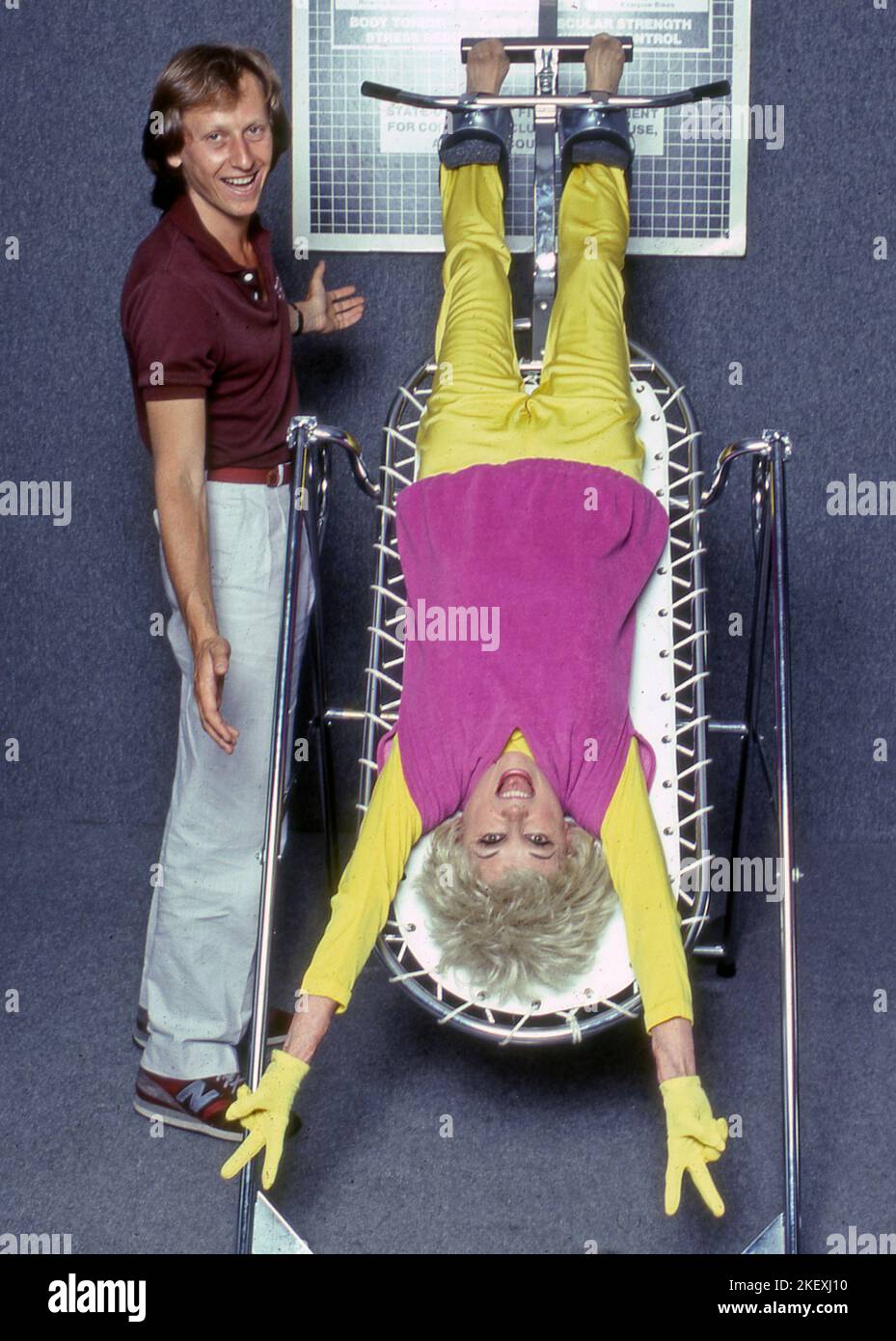 Phyllis Diller and Patrick Netter with inversion device Stock Photo - Alamy