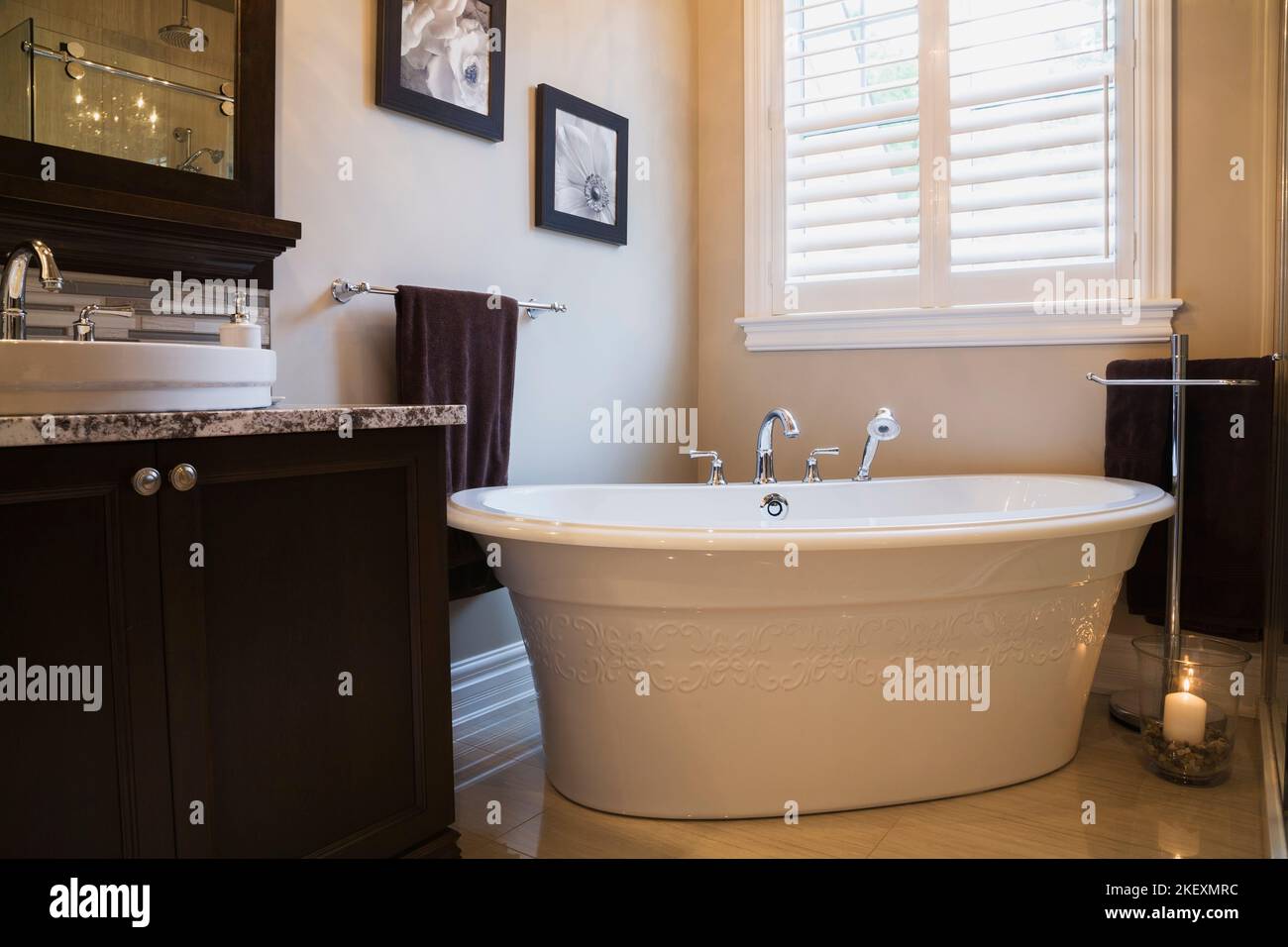 White sink and granite countertop on top of brown chocolate stained