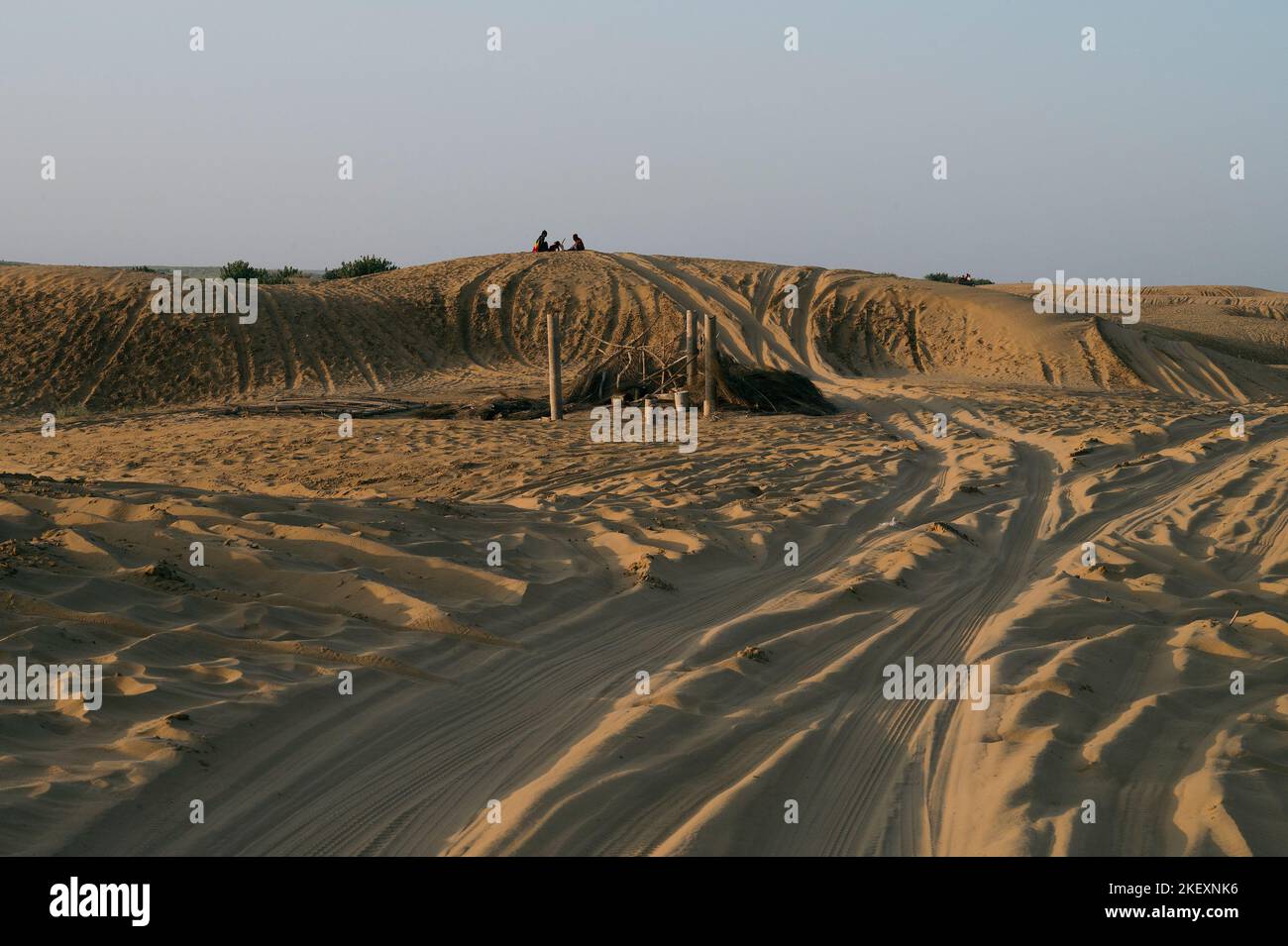 Car tyre marks on sand dunes of Thar desert, Rajasthan, India. Tourists arrive on cars to watch sun rise at desert , a very popular tourist activity . Stock Photo