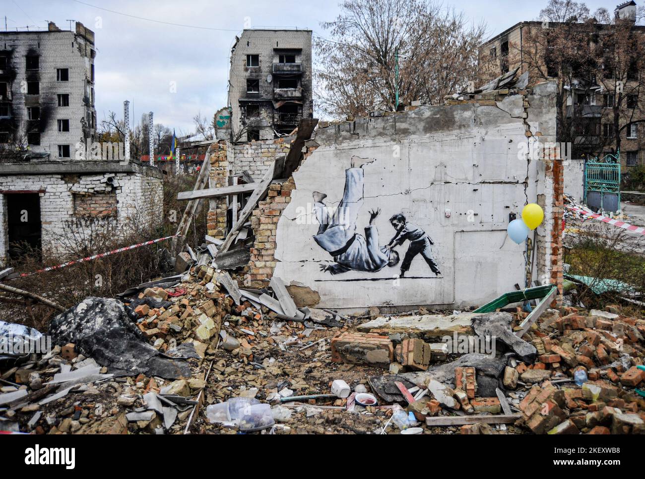 Borodyanka, Ukraine. 14th Nov, 2022. Graffiti made in British street artist Banksy's signature style, on the wall of a building destroyed by the Russian army, in the town of Borodyanka, northwest of the Ukrainian capital of Kyiv. Credit: SOPA Images Limited/Alamy Live News Stock Photo