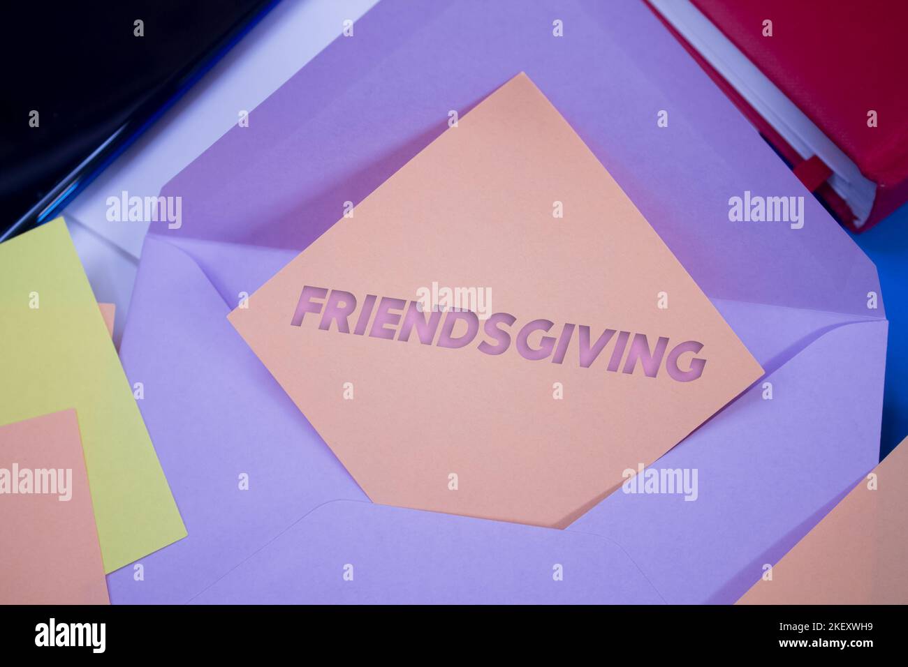 Friendsgiving. Text on adhesive note paper. Event, celebration reminder message. Stock Photo