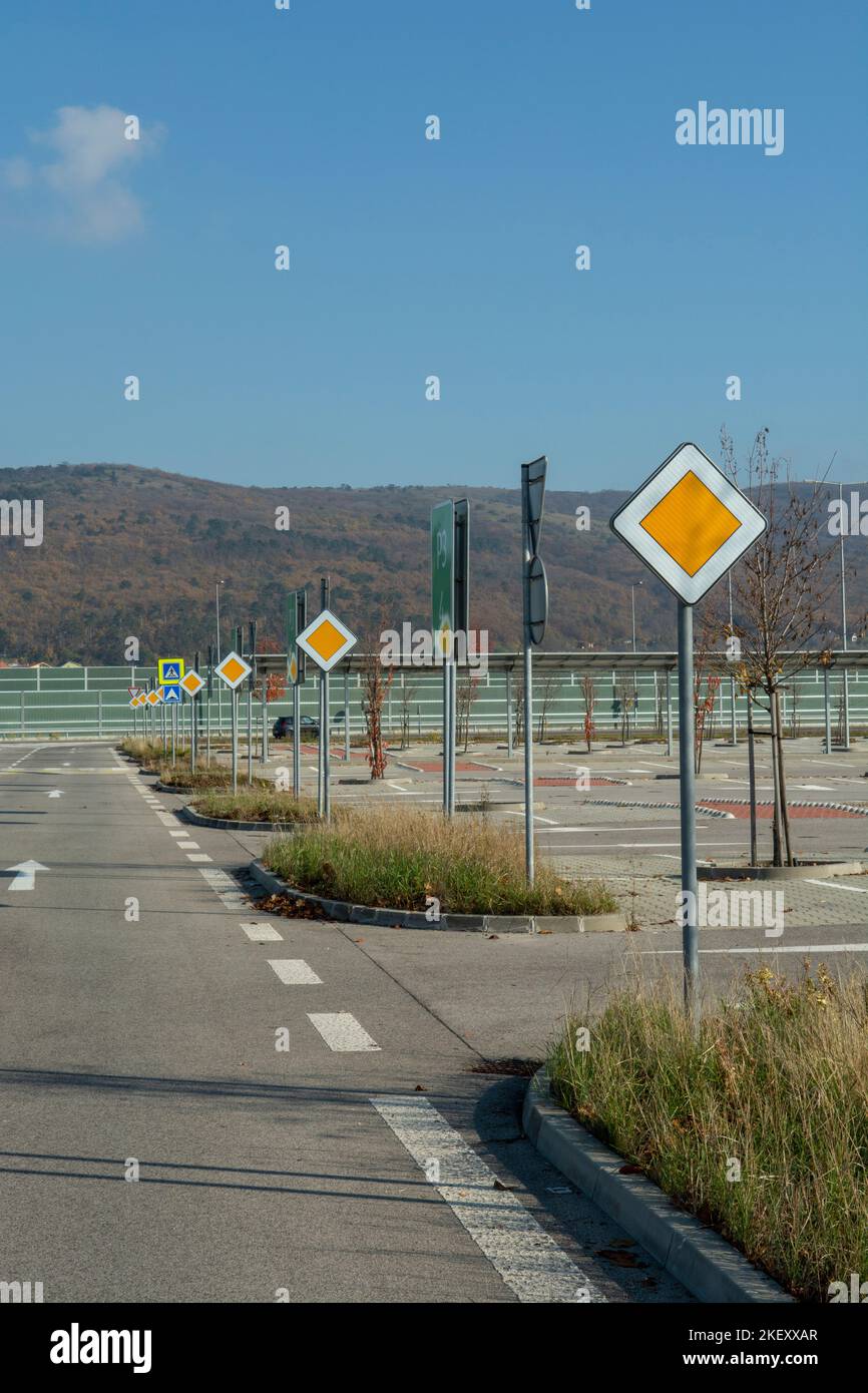 International road signs 'Main road' or 'Priority road' in a row. Many