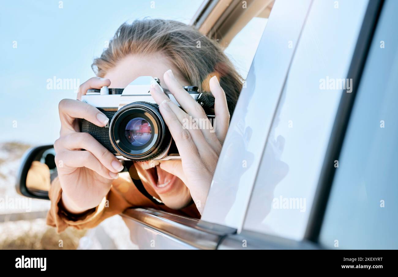 Camera, car and road trip of a woman excited about holiday, adventure and motor travel transport. Photography of a happy person in transportation Stock Photo