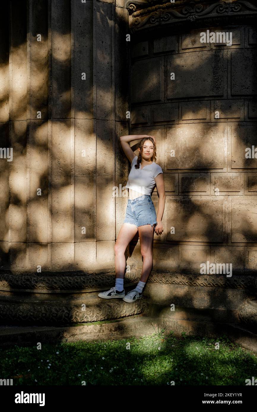 Moody Portrait of Beautiful Teen Girl in Dappled Sunlight Stock Photo