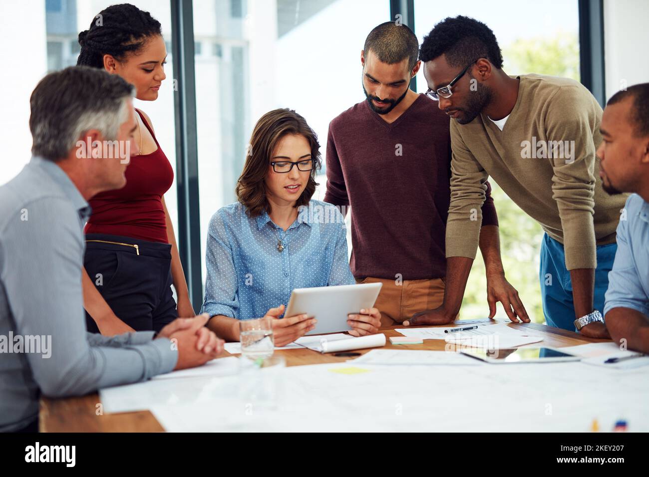 Sharing ideas have never been easier. a group of architects in the boardroom. Stock Photo