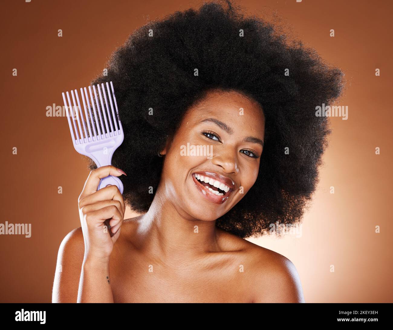 Beauty, hair and afro and black woman and comb for self care, natural and freedom. Happy, smile