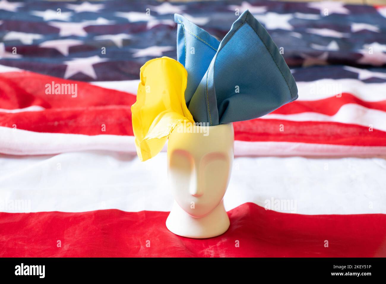 The sculpture of the face and the flag of Ukraine stands on the flags