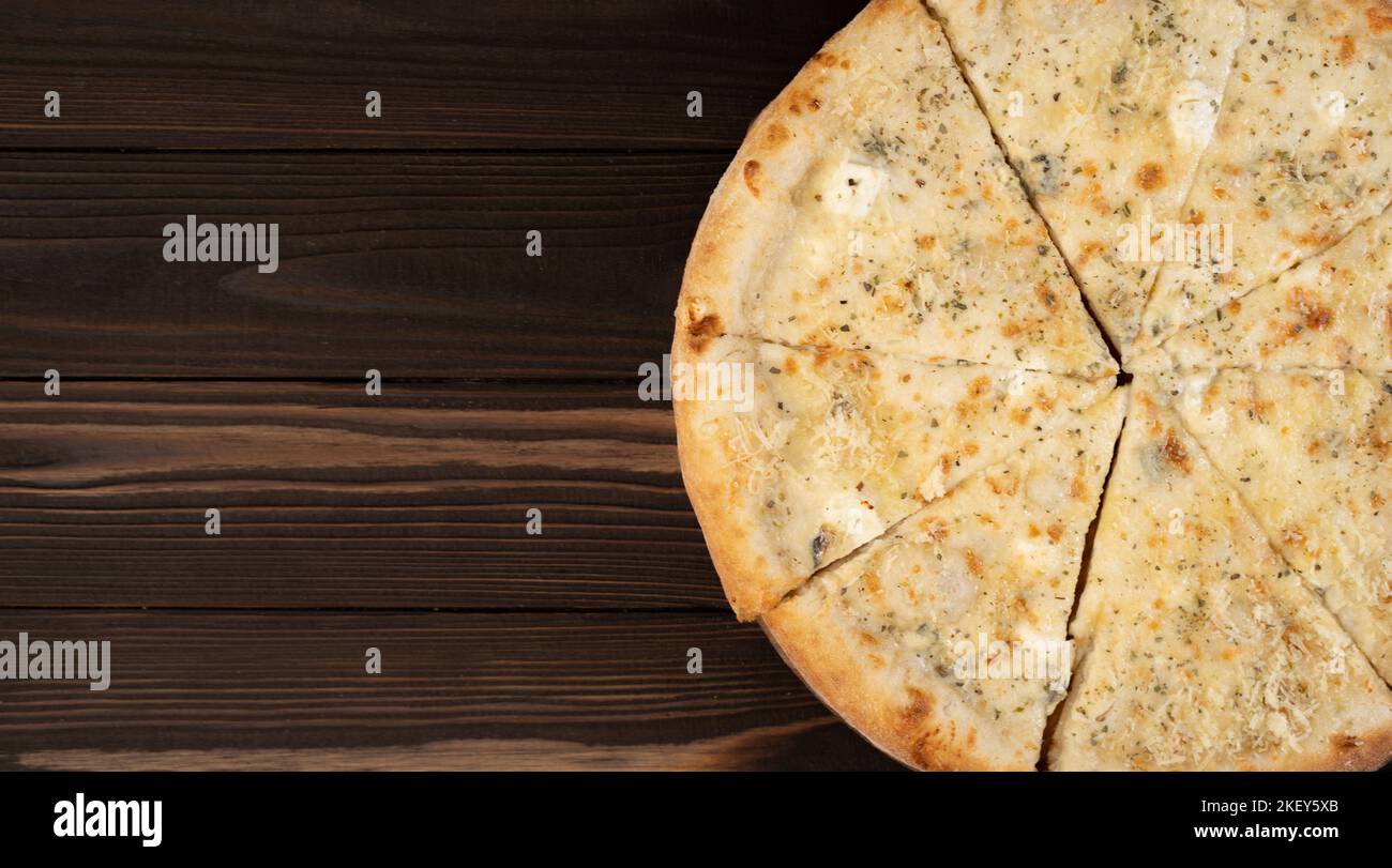 Delicious pizza Four Cheeses with cheddar, Parmesan, mozzarella and