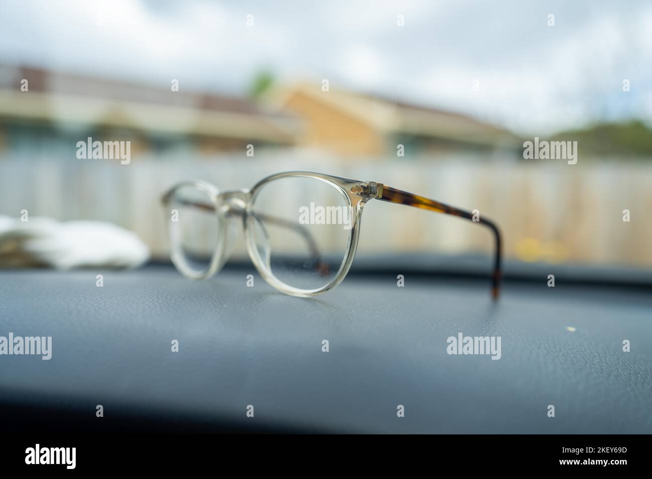 Clear fashionable glasses on the dashboard of a car in australia Stock Photo Alamy