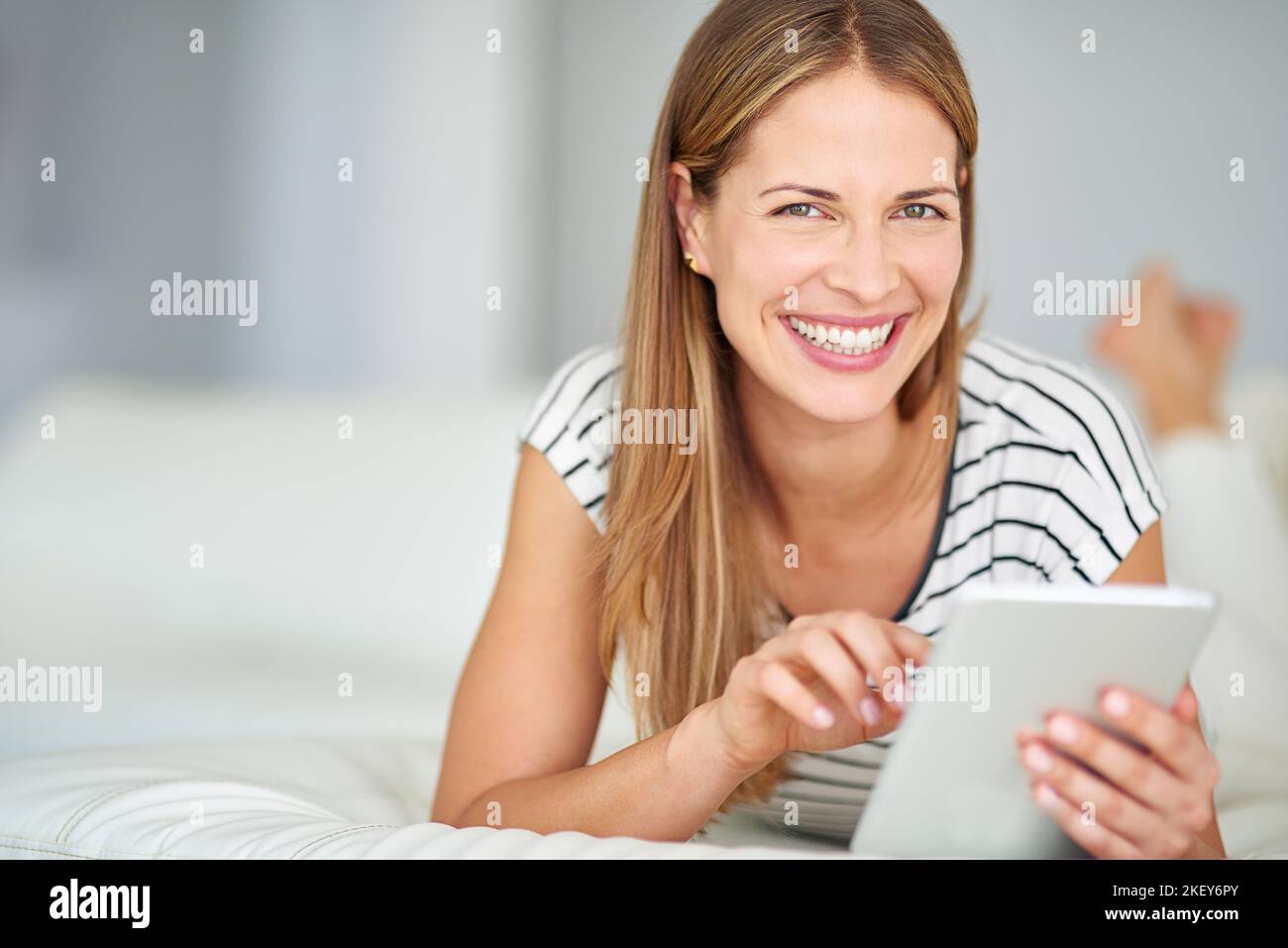 Im very tech savvy. a young woman browsing the internet at home. Stock Photo