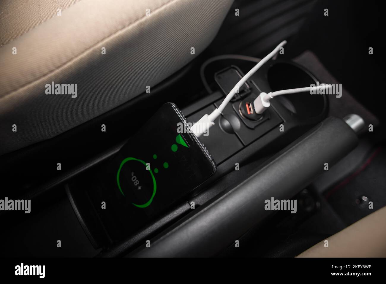 Charging smartphone battery with usb charger in the car Stock Photo - Alamy