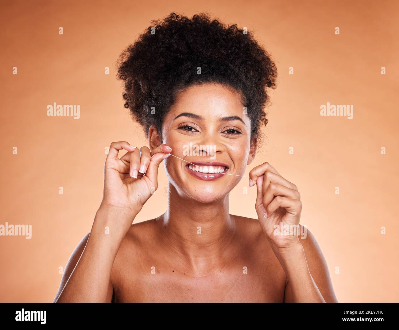 Floss, portrait and teeth of black woman in studio with product for dentist, dental and mouth cleaning healthcare promotion on marketing space Stock Photo