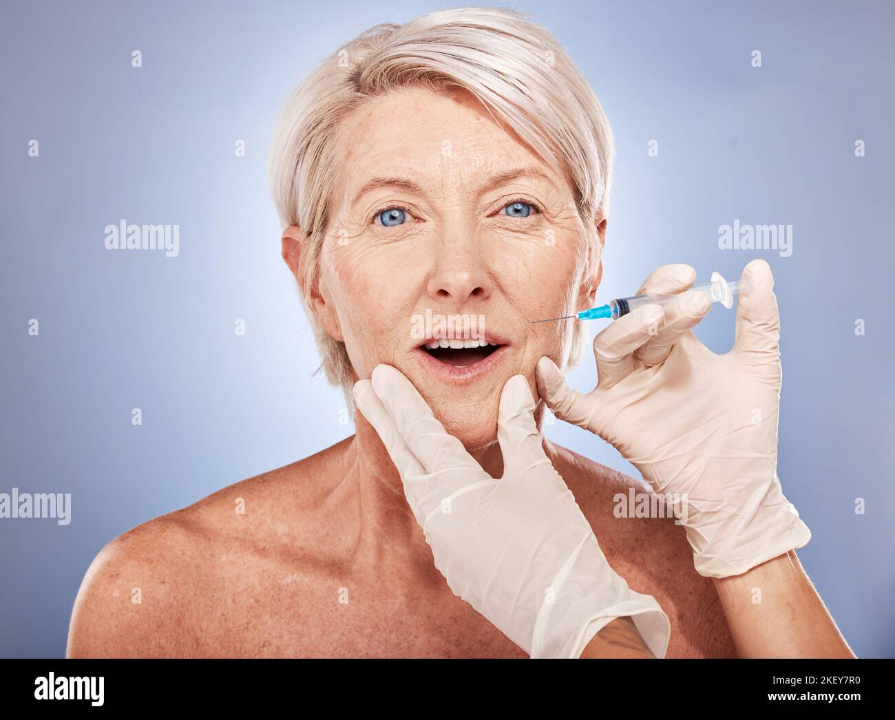 Senior woman, botox injection and syringe with hand for cosmetic surgery, anti aging and beauty product. Elderly model with face, facial and skin Stock Photo