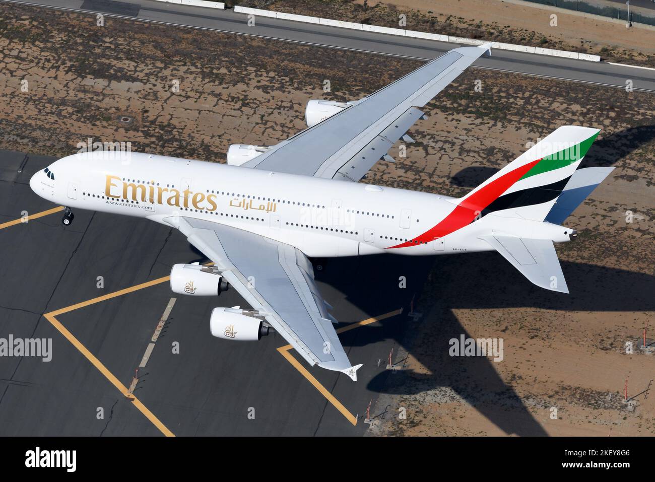 Emirates Airline Airbus A380 aircraft landing, seen from above. Emirates Airlines A380-800 airplane flying. Stock Photo