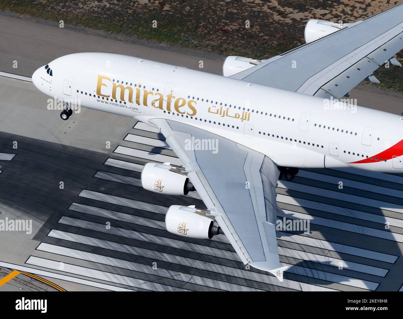Emirates Airline Airbus A380 aircraft landing. Aerial view of Emirates