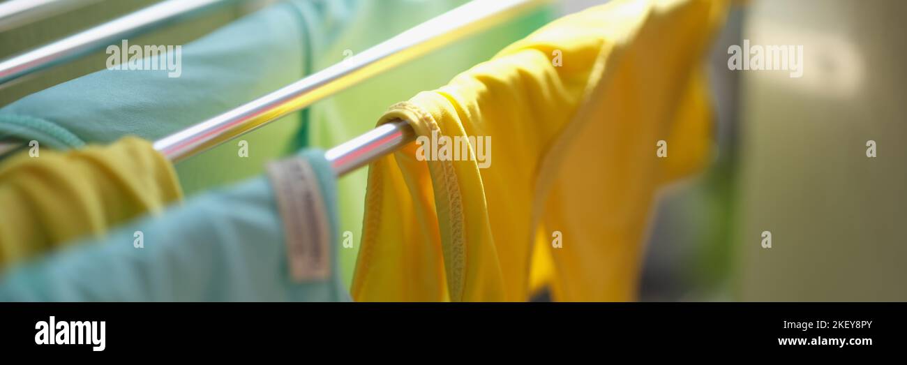 Clean washed clothes are dried in metal dryer closeup Stock Photo Alamy