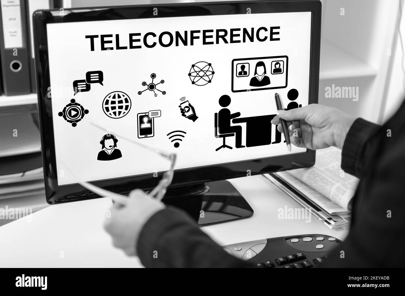 Businesswoman showing teleconference concept on a computer screen Stock