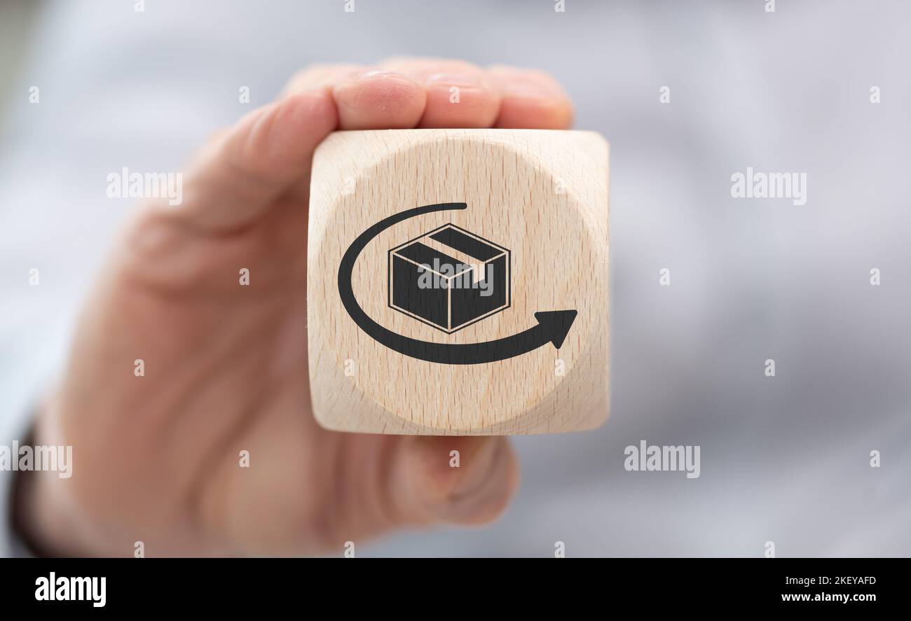 Hand holding a wooden cube with symbol of distribution concept Stock ...