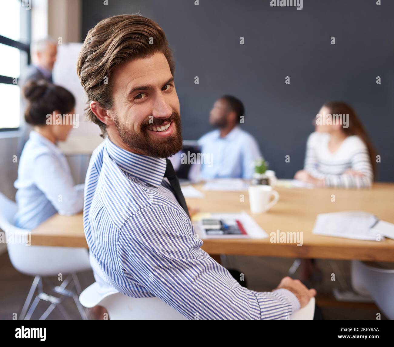 These meetings are never boring. Cropped portrait of a handsome young businessman sitting in the boardroom during a meeting. Stock Photo