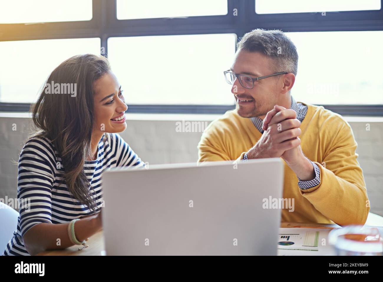 Creativity is contagious, pass it on. coworkers working together on a ...