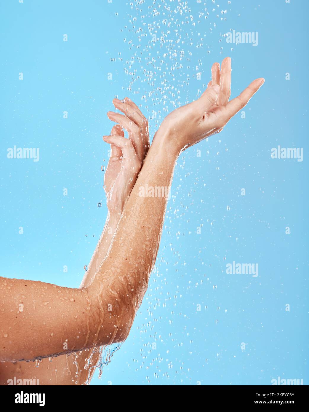 Hand, shower and water with a woman cleansing her body for skincare
