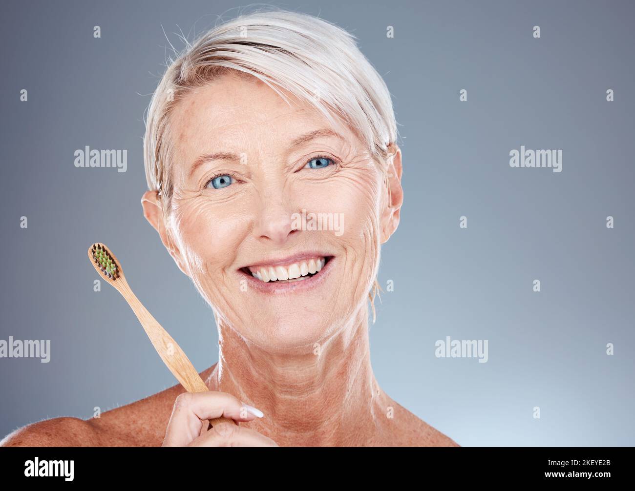 Dental, toothbrush and portrait of senior woman with teeth hygiene, wellness and health in studio. Cosmetic, clean and happy elderly woman with oral Stock Photo