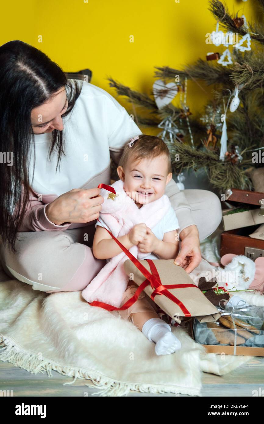 Young Asian mom and dad are unpacking gifts with their daughter Stock Photo  - Alamy
