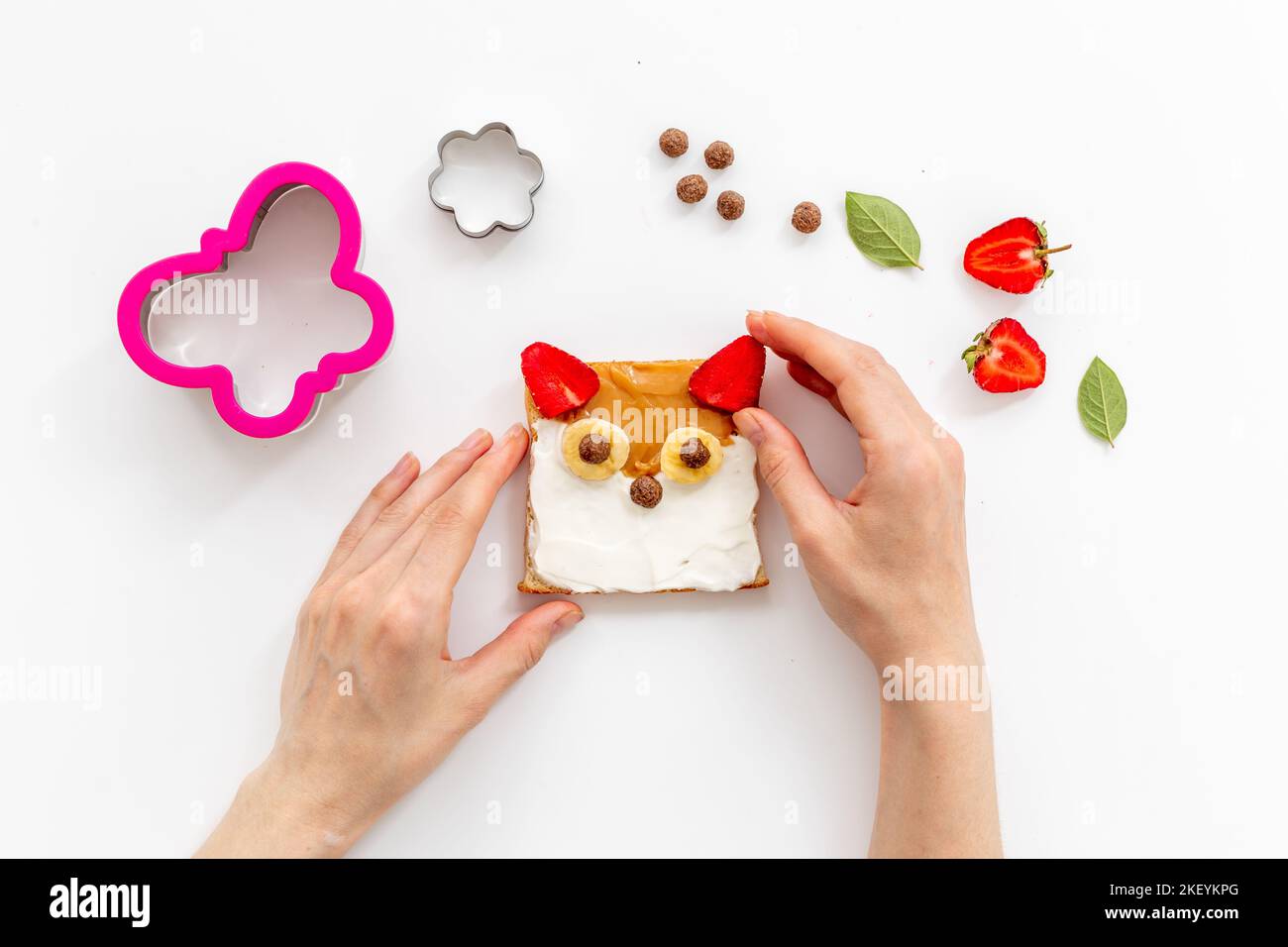 Kids breakfast with fox faces sandwiches made from peanut butter and