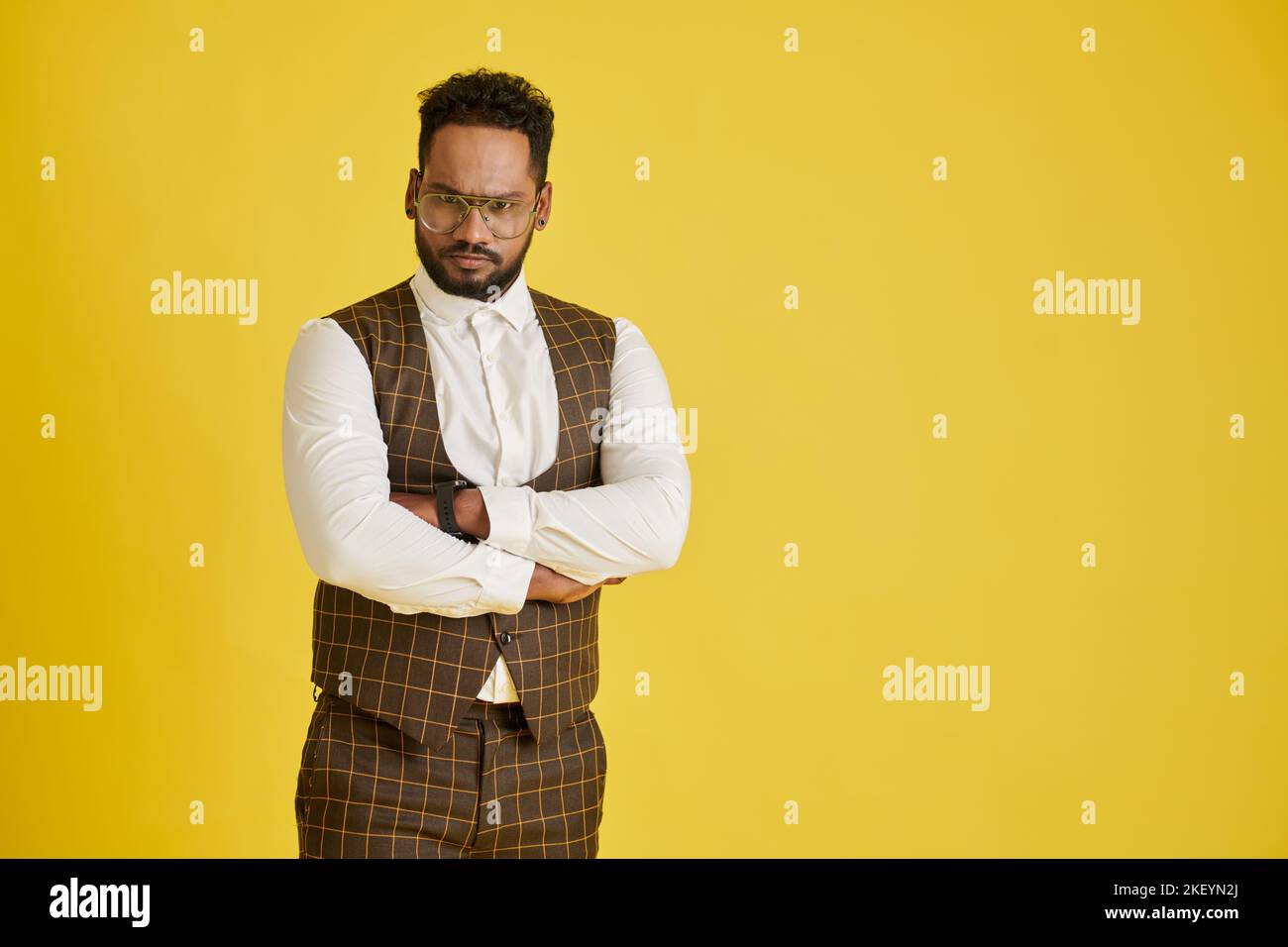 Serious man crossing arms hi-res stock photography and images - Alamy
