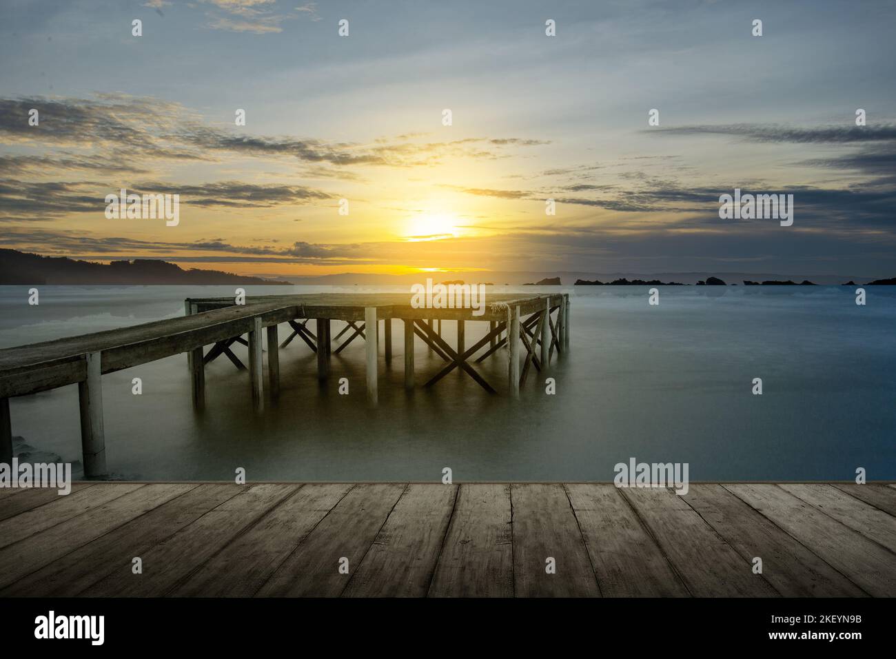 Wooden dock on the lake with sunset sky background Stock Photo - Alamy