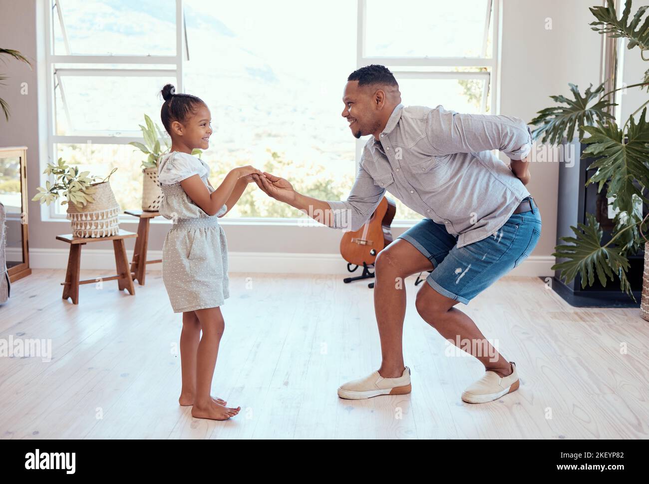 Dad, daughter and dance in home together on floor with love, bonding and care with smile in happy family. Black family, dancer father and girl child Stock Photo