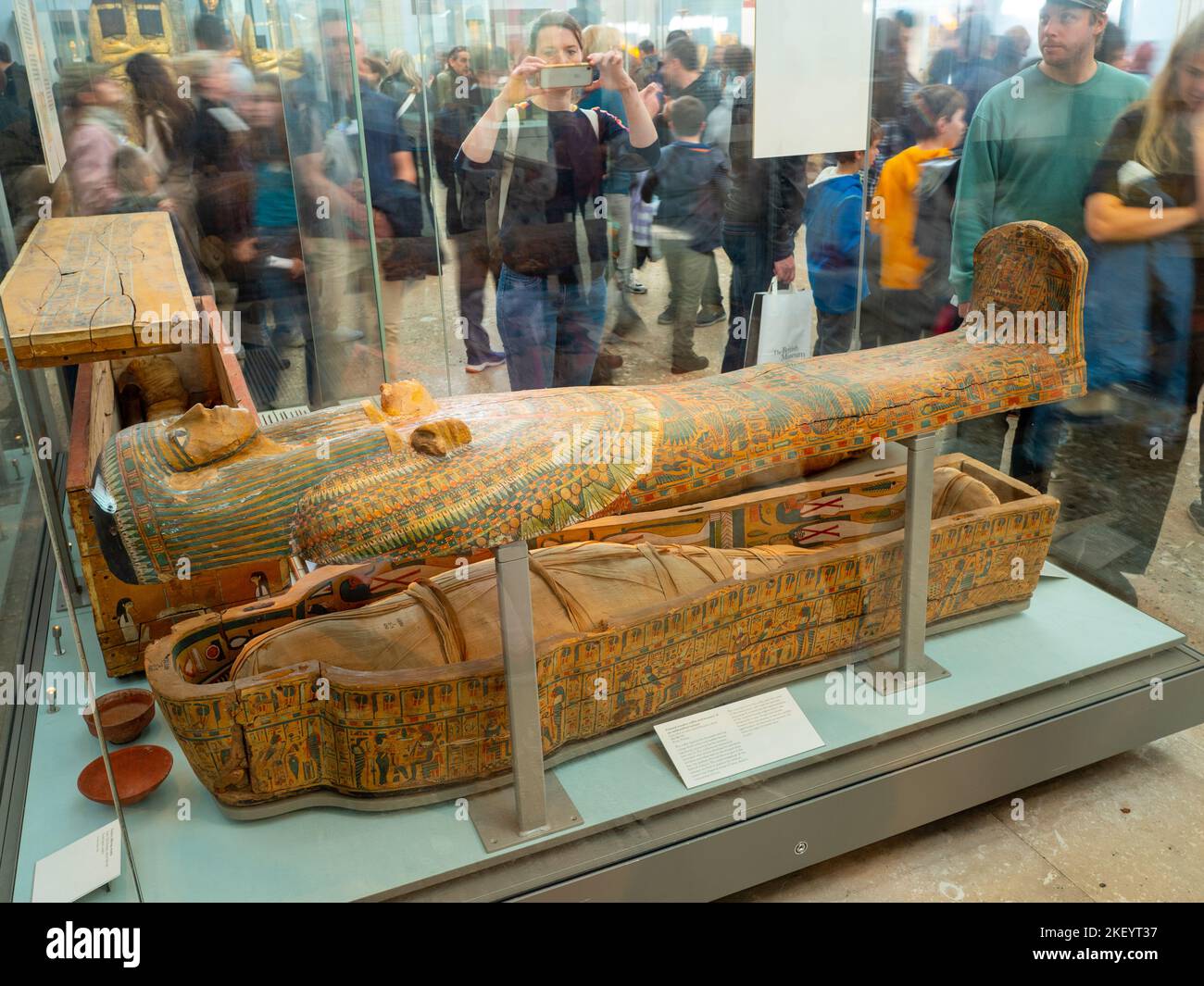 Painted wooden coffin and Egyptian mummy of an unidentified woman from Thebes exhibited in the British Museum, London, UK Stock Photo