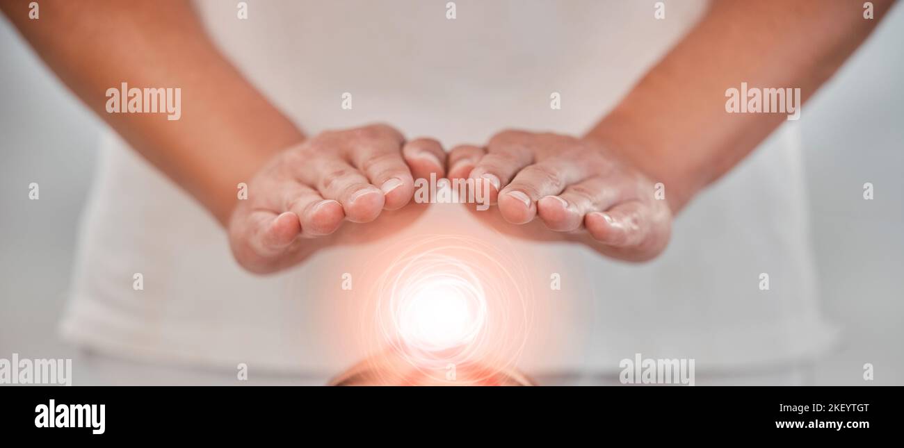 Hands, light energy and chakra healing for spa healthcare and luxury wellness. Woman palm, reiki therapy and spiritual aura expert or healthy power Stock Photo