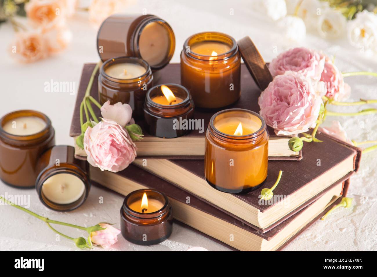 A set of different aroma candles in brown glass jars. Scented handmade ...