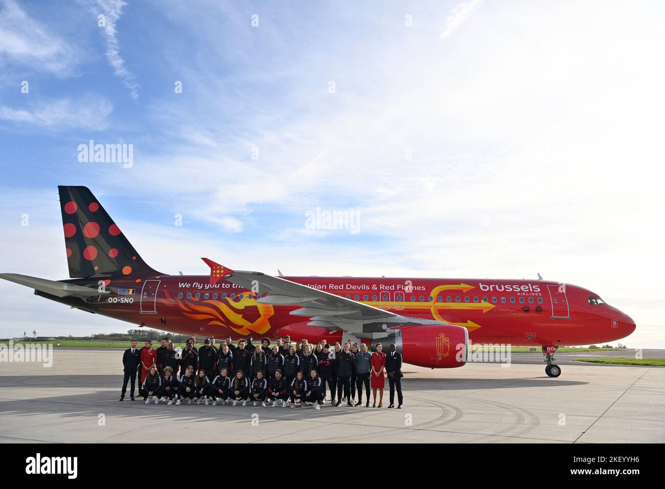 Zaventem. 15 November 2022, Belgium team players pose in front of the plane at the presentation of the new so-called Trident of Brussels Airlines at the departure of Belgian national soccer team the Red Devils from Brussels Airport, Tuesday 15 November 2022, in Zaventem. The Red Devils fly to Kuwait today, for a training camp ahead of the FIFA World Cup 2022. The airplane is painted in special colours for the Belgian national soccer team. BELGA PHOTO ERIC LALMAND Stock Photo