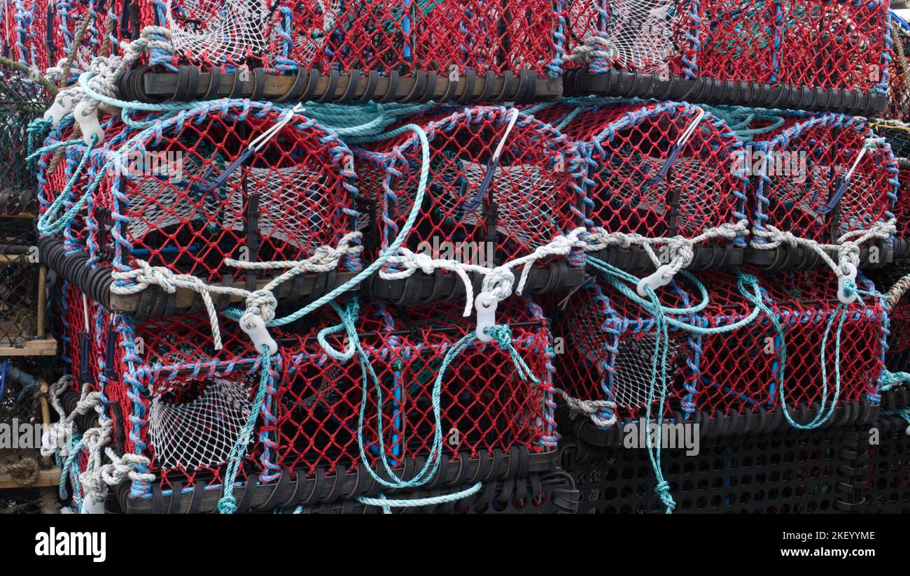 Stack of lobster pots on a quayside in Cornwall Stock Photo