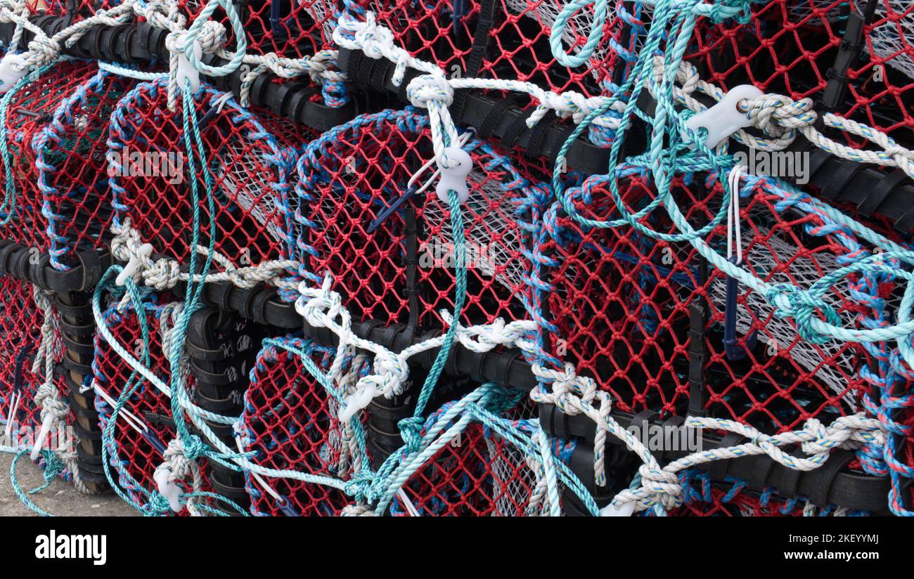 Stack of lobster pots on a quayside in Whitby, North Yorkshire, England, UK Stock Photo